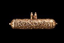 Ca. 1100-1200 AD.
A gold scroll pendant of a cylindrical body, with its delicate tendrils and beaded lines, creates a sense of movement and fluidity, ...