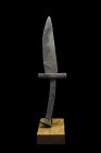 Ca. 13th-15th century AD.
An iron dagger with sleek single-edged blade exudes elegance and simplicity, while the straight cross guard and curved tang ...