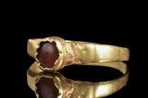Ca. 6th-7th century AD.
A gold finger ring commences with a thin round hoop that envelops the finger with a delicate embrace. The focal point of this ...