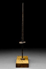 Ca. 14th-15th century AD.
An iron stiletto dagger with a diamond shape in section blade, circular cross guard, and a slim tang finished with a circula...