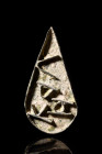Ca. 6th century AD.
A bronze bread seal in its teardrop-shaped form. The visage of the seal, rendered with intricate detail, conceals a world of symbo...