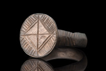 Ca. 600-800 AD.
A bronze finger ring boasting a round hoop, meticulously crafted with a flat inside and a rounded outside, ensuring both comfort and s...