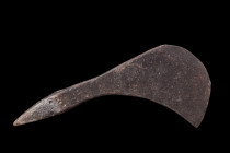 Ca. 900-1100 AD.
An iron axe head, characterized by its asymmetric curved cutting edge and tapering cheek, exemplifies the sophisticated craftsmanship...