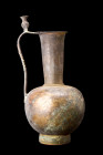 Ca. 8th-9th century AD.
A bronze ewer with a globular body, resting on an elevated concave foot, exhibits a harmonious balance of form and proportion....