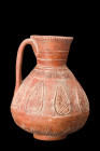 Ca. 1100-1200 AD.
A pottery jug with an inverted pear-shaped body tapers towards the base, conveying a sense of elegance and balance. The low ring foo...