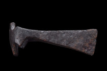 Viking Age, ca. 900-1100 AD.
An axe head with a flaring blade, expertly forged from resilient iron, tapers towards the cutting edge, enhancing its cut...