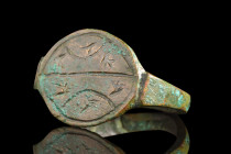Ca. 1st millennium BC.
A bronze finger ring with its form, an epitome of graceful simplicity, commences with a thin round hoop that encircles the fing...