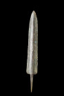 Western Asiatic/Aegan, ca. 1200-700 BC.
A bronze spearhead boasts a double-edged blade with parallel sides, skillfully tapering to a finely honed poin...