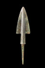 Western Asiatic/Aegan, ca. 1200-700 BC.
Crafted from bronze, this spearhead showcases a triangular-shaped blade that elegantly tapers to a keenly hone...