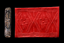 Ca. 3000 BC.
Cylinder seal of dark stone. Linear design of a kind of Greek cross enclosed within wide V-shaped bands on each side. Very good condition...