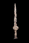 Ca. 500-400 BC.
An iron Acinaces-type sword. Its form, a study in sleek functionality, presents a pointed, elongated triangular blade that commands at...