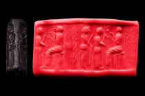 Ca. 2nd millennium BC.
A hematite cylinder seal, likely from Late Bronze Age Cyprus or Eastern Anatolia. It depicts an enthroned deity, a life tree, a...