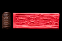 Ca. 1400-1300 BC
.
A Mitanni-style cylinder seal from Northern Mesopotamia, ca. 1400-1300 BC. A very schematic depiction of birds and a large rhomboid...