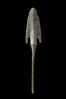 Western Asiatic/Aegan, ca. 1200-700 BC.
A bronze spearhead crafted with great care and attention to detail. This lentoid blade boasts a prominent midr...