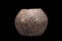 Ca. 3rd millennium BC.
A small jar fashioned from stone and distinguished by its marbled pattern. The jar boasts a flat base that provides stability, ...