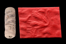 Ca. 1000-600 BC.
Cylinder seal of faience. Large standing bird, rhomb behind head; quadruped at the gallop, two trees beneath; another smaller quadrup...