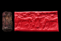 Likely Bactrian/Turkmenistan, ca. 2000 BC.
A cylinder seal, likely from Bactria. It depicts a human figure with a horse and an X-shaped star above it....