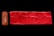 Likely Bactrian / Turkmenistan, ca. 2nd or 1st millennium BC.
A reddish stone cylinder seal, likely from ancient Bactria. It depicts ibexes and a life...