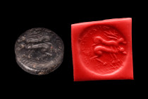 Ca. 2nd millennium BC or later.
A beautiful black stamp seal from the region of Bactria/Turkmenistan. It depicts male and female deer. Studied by PD D...