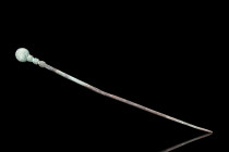 Ca. 2nd millennium BC.
A cast bronze cloth pin with its sleek, slender form, tapering to a sharp point, and opposite terminal capped with a round fini...