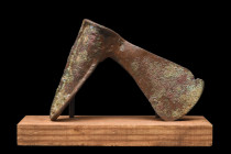 Ca. 2nd millennium BC.
A bronze axe head, characterized by its round-section shaft and blade flaring to a cutting edge. Bronze axes were versatile too...