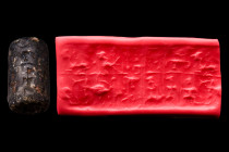Ca. Early 2nd millennium BC.
A dark stone cylinder seal, likely from the Old Assyrian period, early 2nd millennium BC. It depicts rows of animals and ...