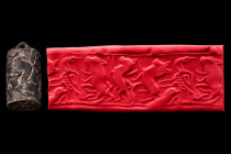 Ca. Early 3rd millennium BC.
A black stone hammer seal, likely from Old Elam (Iran), early 3rd millennium BC. It depicts lions and a bird of prey. Stu...
