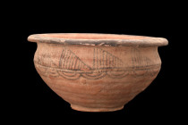 Ca. 2500 BC.
A nicely-shaped pottery bowl rising from a low ring foot. The body flares gently to a shoulder and then tapers gradually to an outward tu...