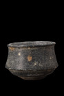 Ca. 2nd millennium BC .
A schist vessel featuring a deep body with a conical-shaped base, corseted walls, and a pronounced rim, culminating in a strik...