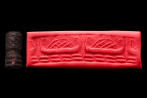 Ca. 2200-2100 BC.
A black stone cylinder seal with a boat laden with cargo on water. Very good condition. Accompanied by a signed scholarly note by Pr...
