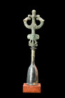 Ca. 900-700 BC.
A bronze sceptre features a janiform design, with a highly stylized anthropomorphic figure depicted prominently at its center, firmly ...