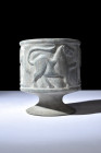 Ca. 3rd-2nd millennium BC.
This tubular cup, endowed with a pronounced rim, rests elegantly atop a splayed foot, elevating both form and function to a...