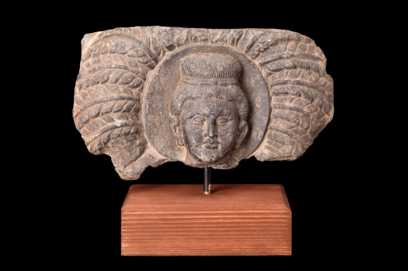 Ca. 200-300 AD.
A stone schist panel featuring a central relief depicting the he...