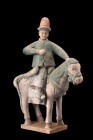 Ca. 1368-1644 AD, or later.
A moulded terracotta figure depicting a rider on horseback, with the animal shown in a standing pose atop of a flat, integ...