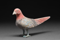 Ca. 202BC - 220AD.
An earthenware bird figure standing on its bronze legs and its body is decorated with vivid polychromy. This bird is a mingqi, 'spi...