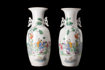.
A pair of porcelain vases, each featuring a bulbous, elongated body that tapers gently to form a funnel-shaped neck, thereby exuding a harmonious se...