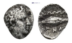 Ionia. Magnesia ad Maeander . 465-459 BC. Hemiobol AR. 0.17 Gr. 6mm.
Male head (Themistokles?) right. 
Rev. Barley grain