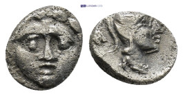 Pisidia. Selge circa 350-300 BC. Obol AR (10mm, 0.92 g) Gorgoneion / Head of Athena to right, wearing crested Attic helmet; behind, astragalos.