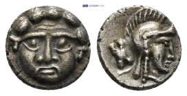 Pisidia. Selge circa 350-300 BC. Obol AR (15mm, 0.78 g) Gorgoneion / Head of Athena to right, wearing crested Attic helmet; behind, astragalos.