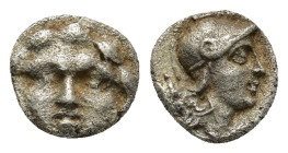 Pisidia. Selge circa 350-300 BC. Obol AR (9mm, 0.94 g) Gorgoneion. / Head of Athena to right, wearing crested Attic helmet; behind, astragalos.