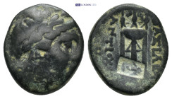 SELEUKID KINGDOM. Antiochos II Theos (261–246 BC). Ae. (15mm, 4.23 g) Sardeis. Obv: Laureate head of Apollo right. Rev: BAΣΙΛΕΩΣ ANTIOXOY. Tripod....