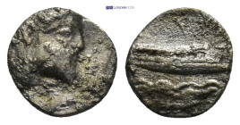 PHOENICIA. Aradus. Ca. 400-350 BC. AR obol 0.8 Gr. 9mm.
Laureate, bearded head of Ba'al-Arwad right 
Rev. MA' (Phoenician), galley sailing right over ...