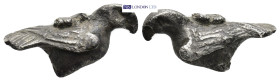 A miniature silver eagle with folded wings and incised details. (22mm, 5.38 g)