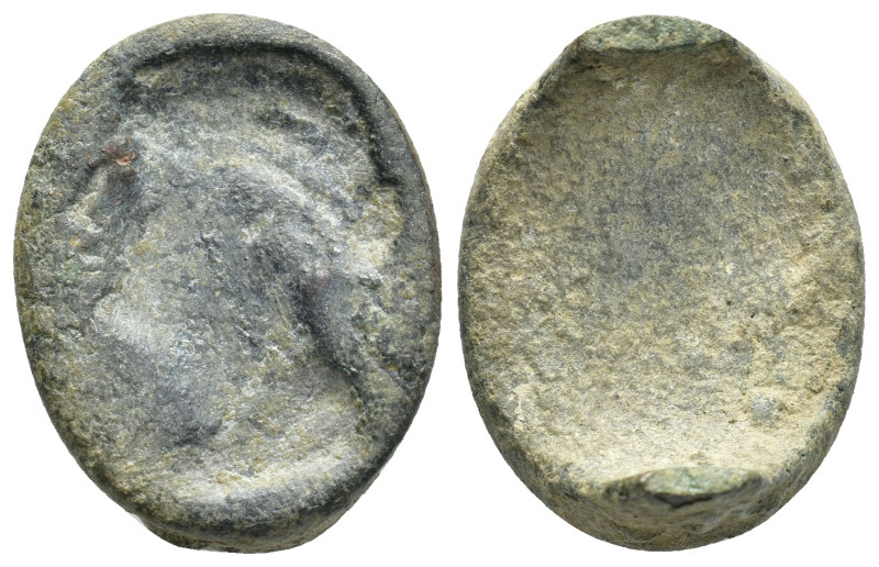 Bronze ring fragment. Head of men? Left. (23mm, 7.36 g)