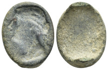 Bronze ring fragment. Head of men? Left. (23mm, 7.36 g)