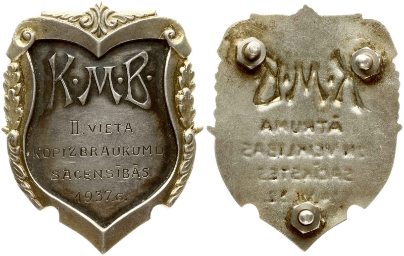 Latvia. Badge KMB II place (1937). Brass silvered, partial gilding. 51 x 41 mm, ...