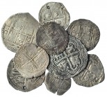 9 monedas de plata: 4 reales (2), Granada y Sevilla; 2 reales de Potosí (2), uno con agujero; real, Sevilla (3), uno con agujero; real, México, M-O; r...