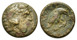Italy, Bruttium, Kroton. c. 350-300 BC. Æ (15,8mm, 4,2g). Head of Herakles right, wearing lion skin. R/ Eagle right, alighting on snake; ivy leaf to l...