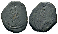 John II ? (1118-1143). Overstruck Æ Half Tetarteron (17mm, 1.60g). Thessalonica. Christ Pantokrator standing facing on dais. R/ Facing bust holding la...