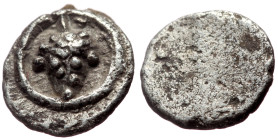 Macedon, Tragilos (?) AR Hemiobol (Silver, 0.25g, 7mm) ca 450-400 BC. 
Obv: Bunch of grapes 
Rev: (blank), Quadripartite incuse square; P-A/T-I in qua...